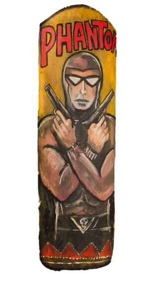 Illustration for article titled Why Does This Comic Book Hero Appear On So Many New Guinea War Shields?